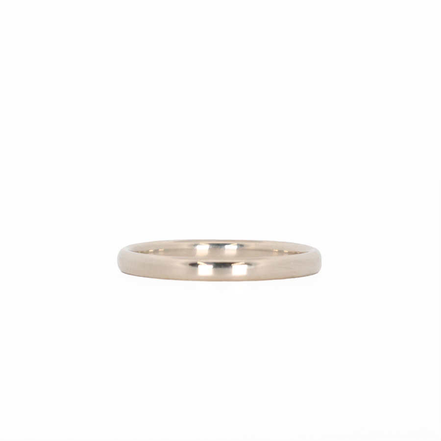white gold stackable ring laying flat