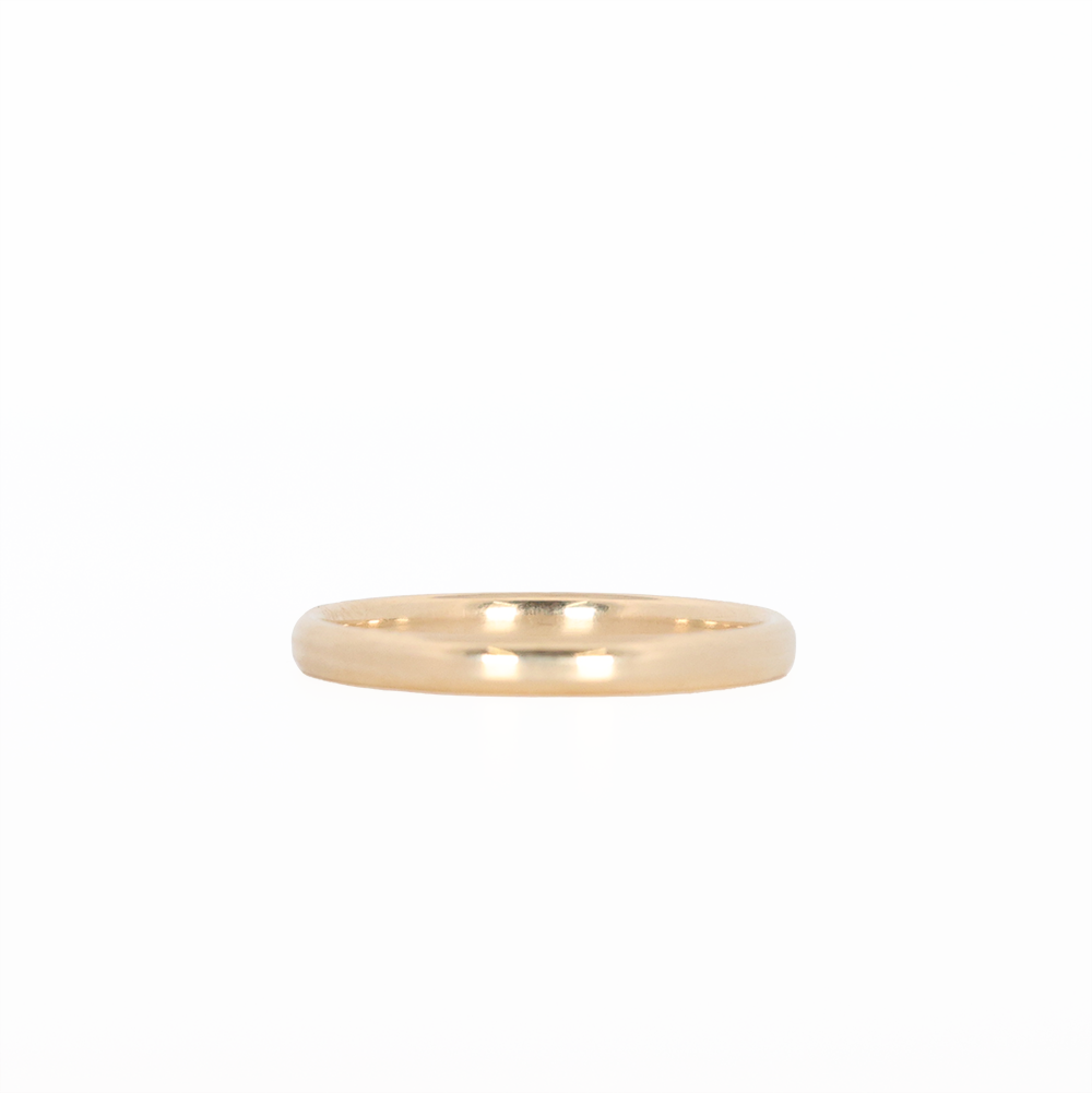 yellow gold stackable ring laying flat