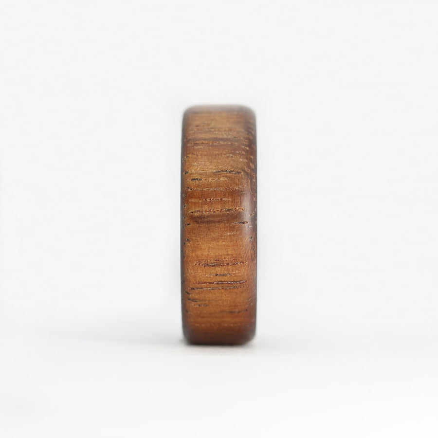 koa wood ring with carbon fiber sleeve front view