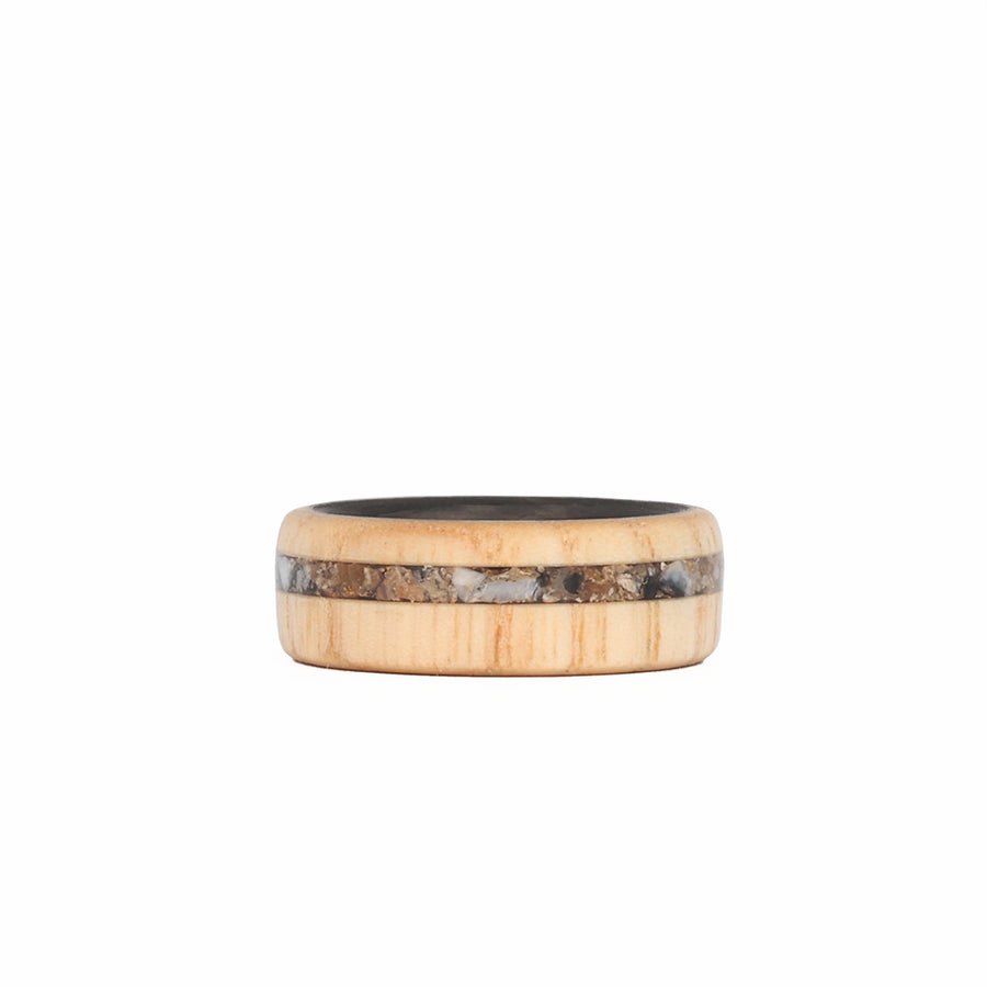Ash Wood Ring with Fossilized Mammoth Molar Inlay and Carbon Fiber Sleeve Laying Flat