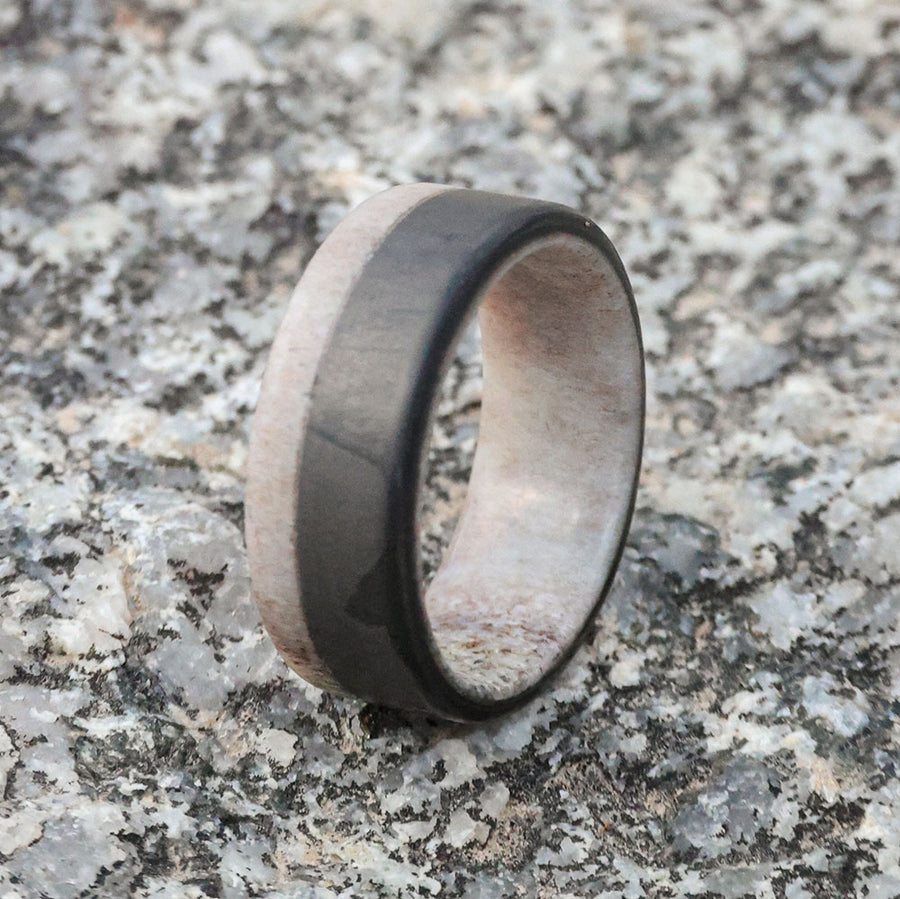 Antler wedding band with carbon fiber on marble