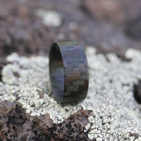 Ultralight Glowing Carbon Fiber Ring On A Rock