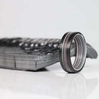 Fordite Men's Ring with Carbon Fiber Rails with a plate of Fordite