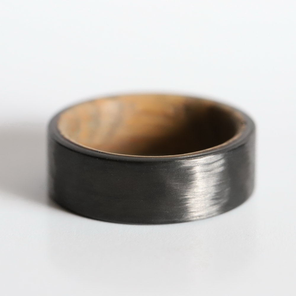whiskey barrel wedding ring with carbon fiber exterior showing off exterior