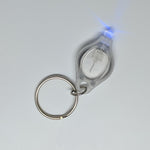 A micro uv key chain light on a table