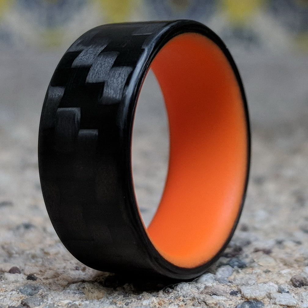 Orange Glow Ring with Carbon Fiber 3/4ths View Closeup