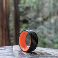 Orange Glow Ring with Carbon Fiber Outside In A Forest