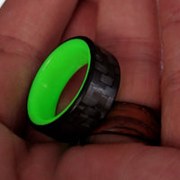 Yellow Glowing Resin Ring with Carbon Fiber in hand
