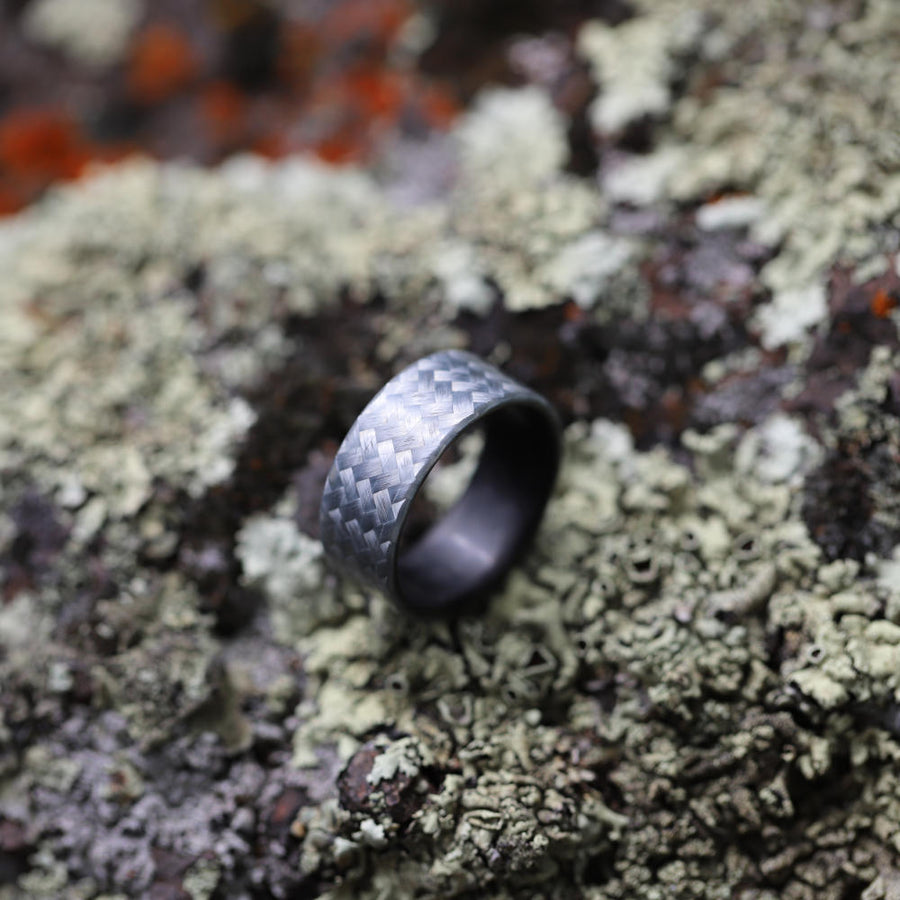 fiberglass ring with carbon fiber sleeve on stone