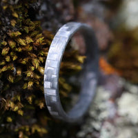gray stackable ring made from glass fiber on moss