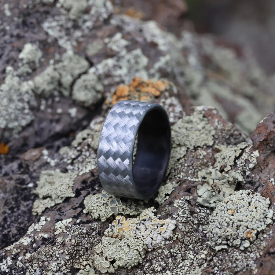 fiberglass ring with carbon fiber sleeve on fossilized stone