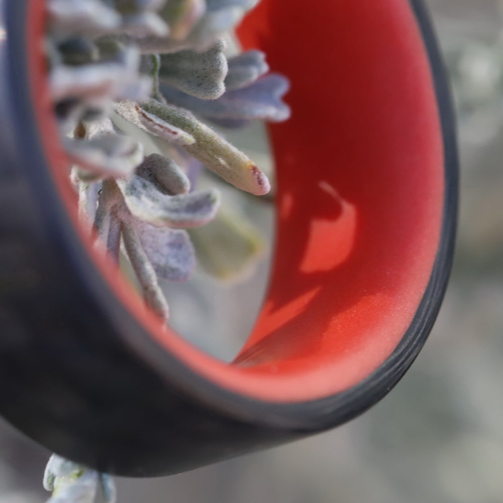 Red Glowing Ring with Carbon Fiber On A Tree