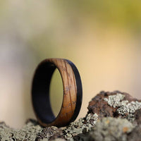 Men's whiskey barrel ring with carbon fiber on the rocks