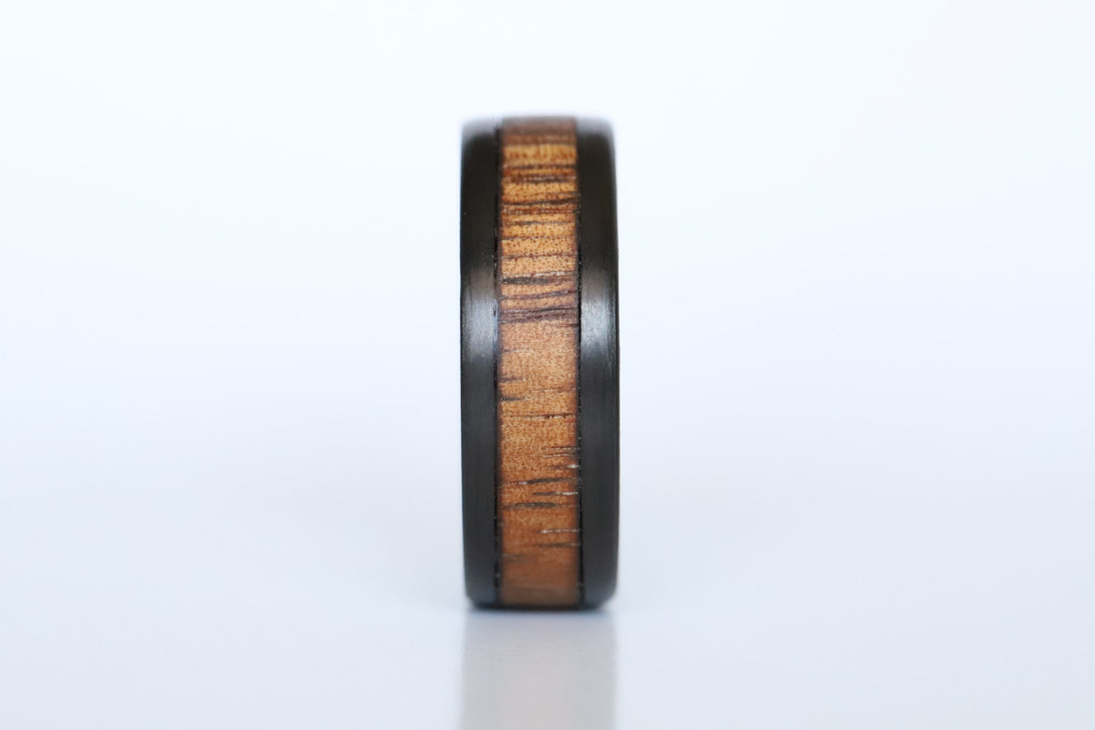 Koa Wood and Titanium wedding ring front close up