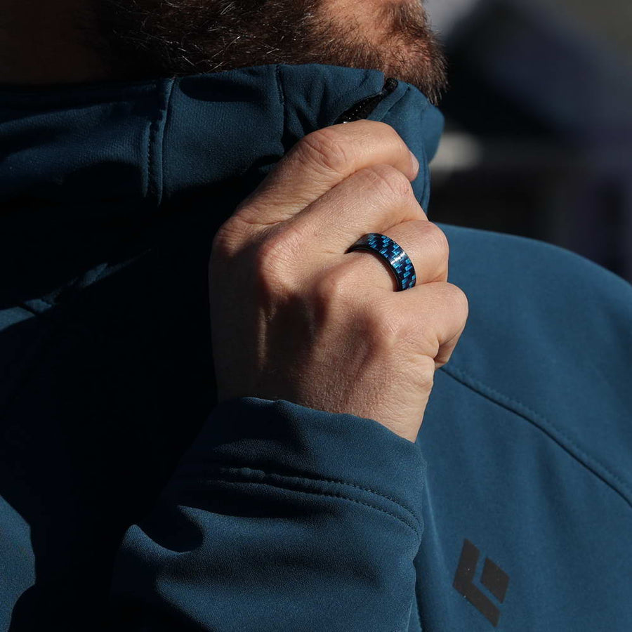 Blue Carbon Fiber Ring with Blue Aluminum Interior On Finger Close Up