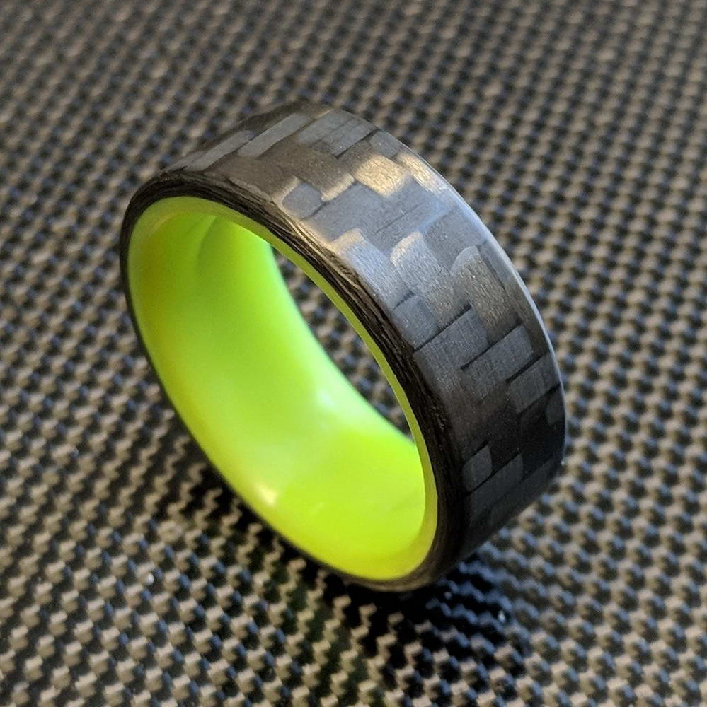 Yellow Glowing Resin Ring with Carbon Fiber overhead view