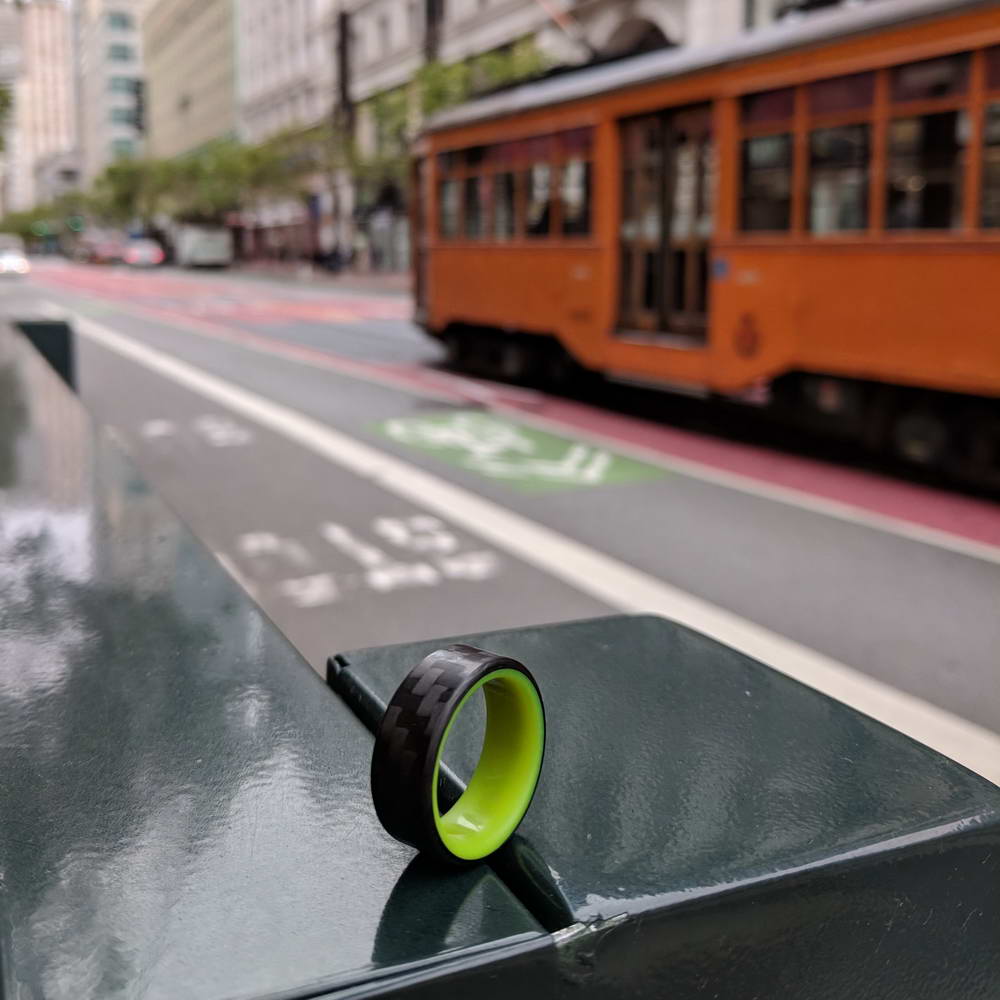 Yellow Glowing Resin Ring with Carbon Fiber on city street