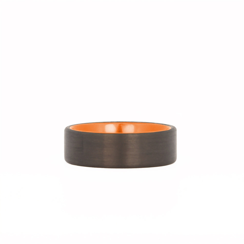 Orange Aluminum Wedding Ring with Carbon Fiber Exterior Laying Flat