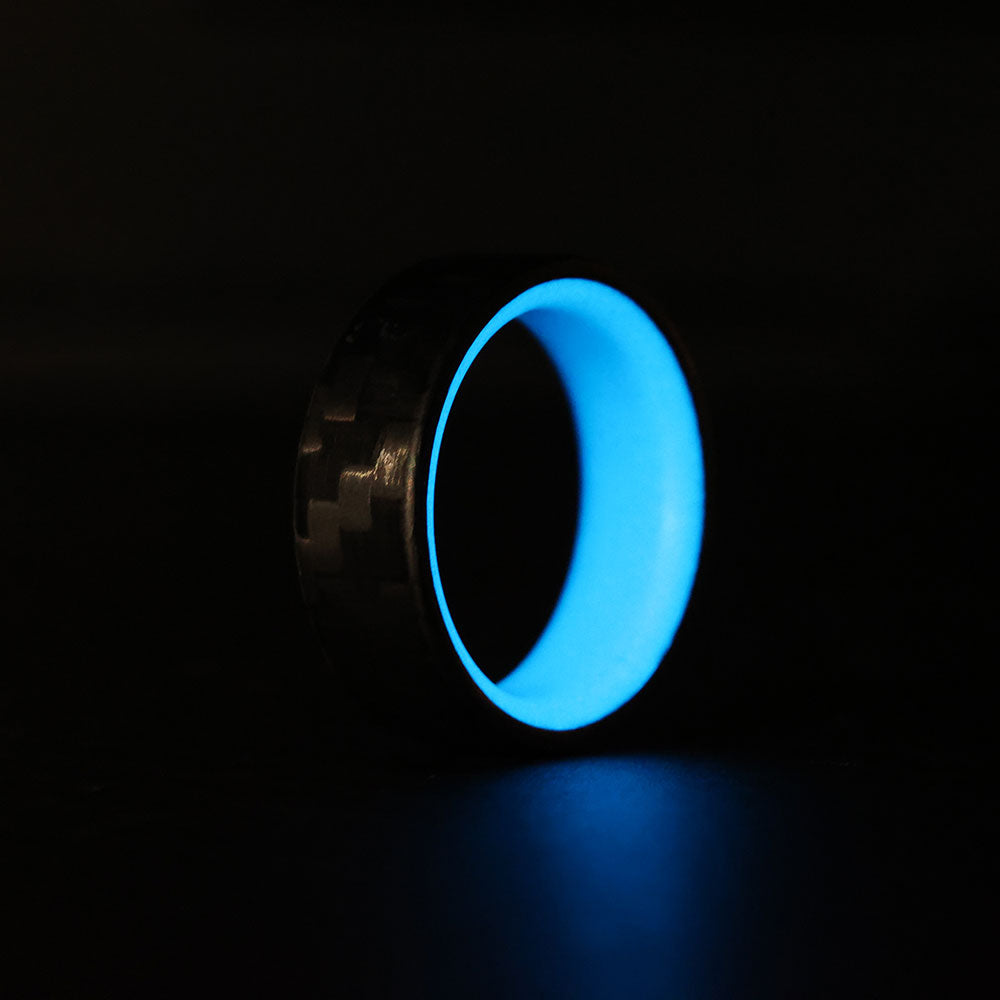 Blue Glowing Resin Ring with Carbon Fiber Exterior glowing side view