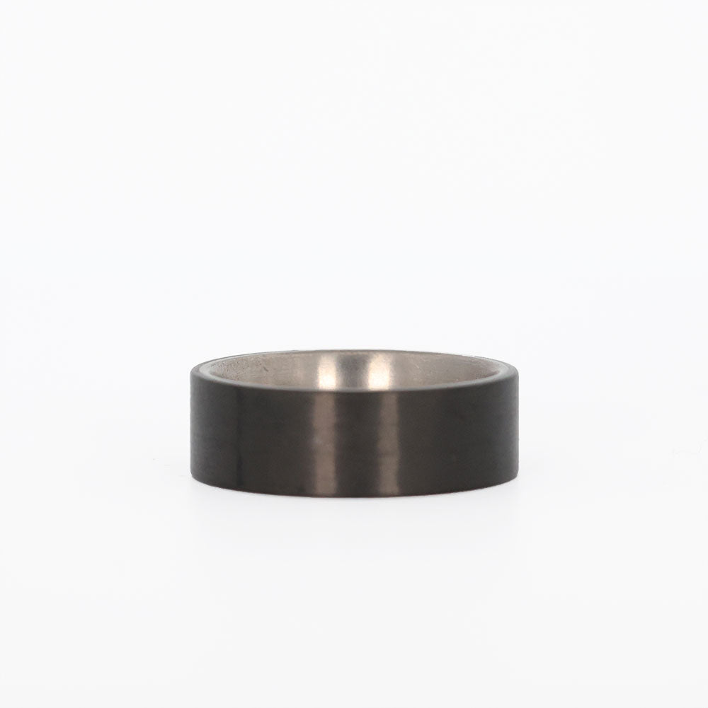 Men's Titanium Wedding Ring with Carbon Fiber Exterior Laying Flat