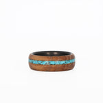 Turquoise Inlay Ring with Whiskey Barrel Wood and Carbon Fiber Sleeve Laying Flat