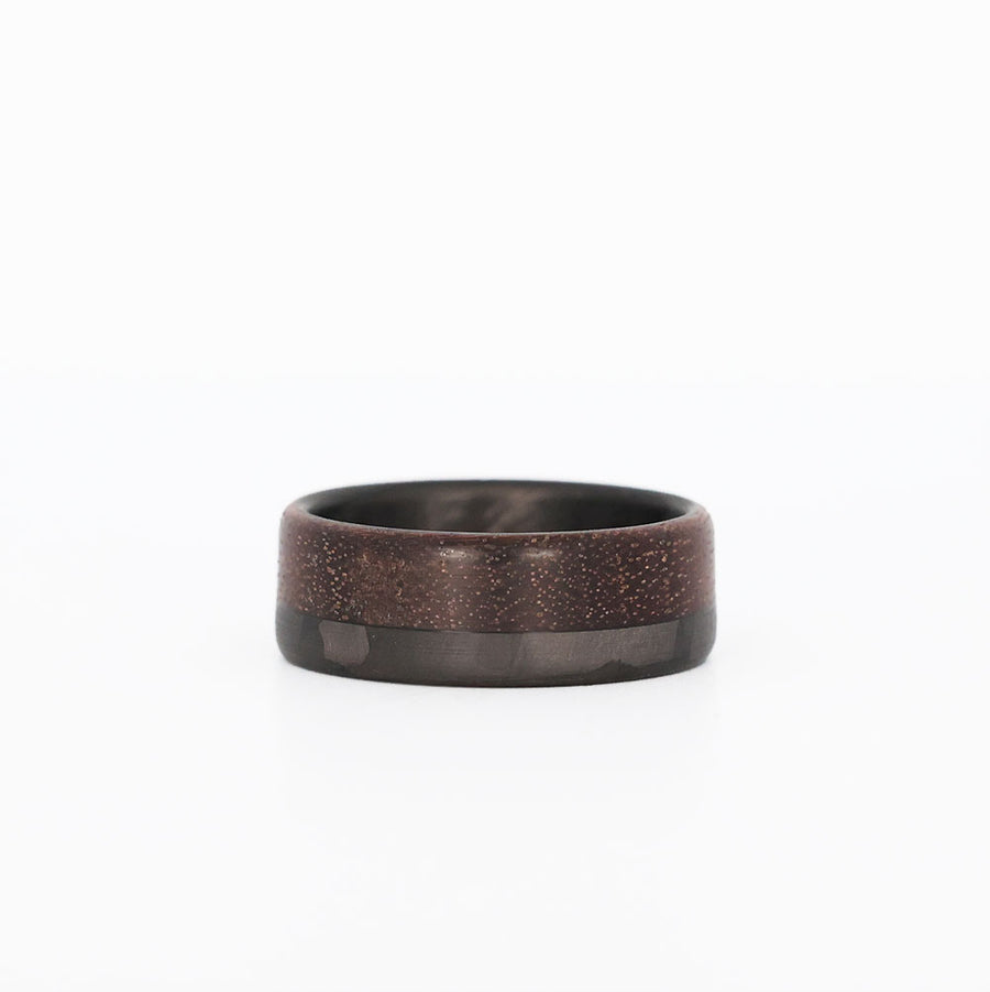 70/30 walnut wood ring with carbon fiber sleeve laying flat
