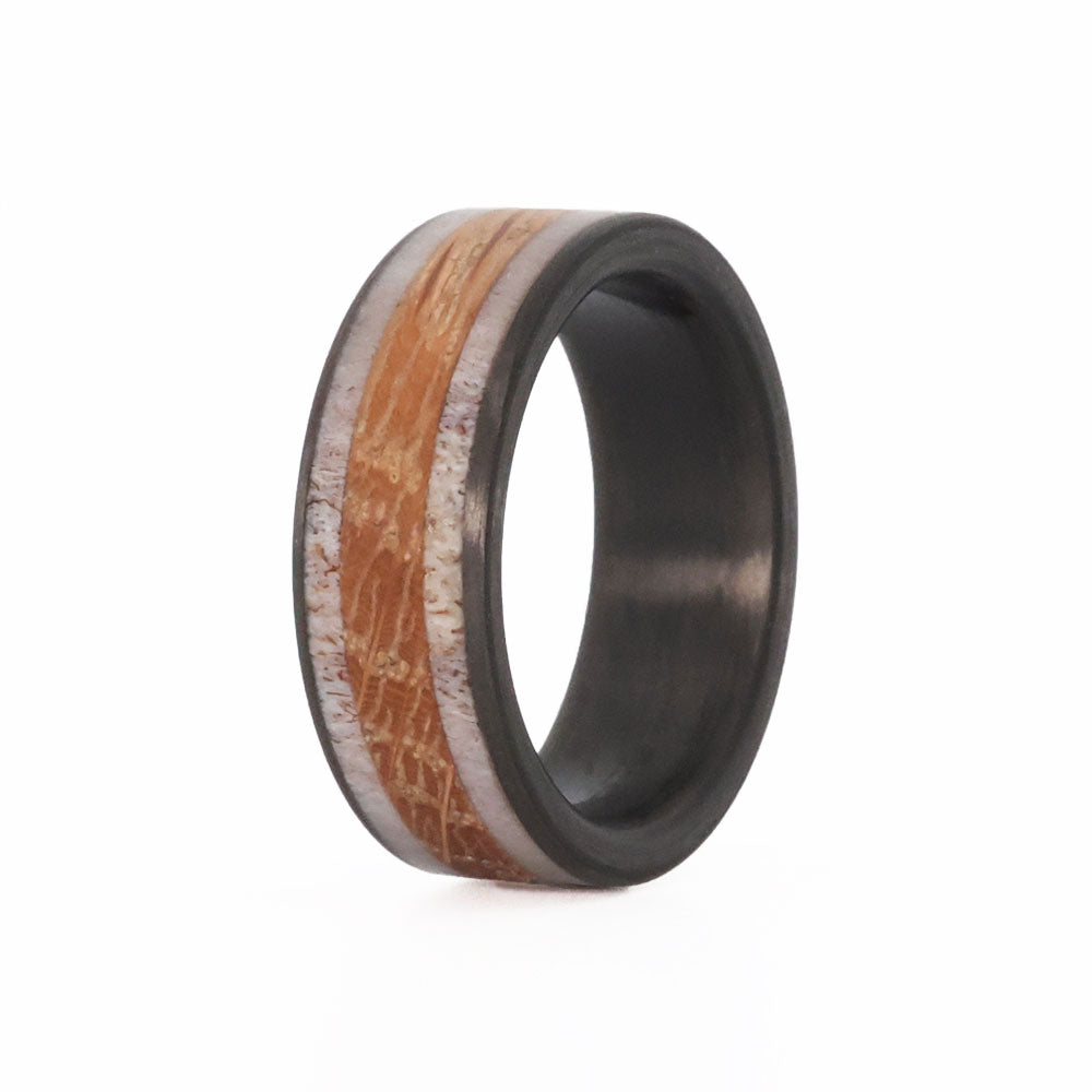 Deer antler wedding band with whiskey barrel wood and carbon fiber sleeve