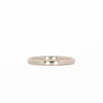 white gold stackable ring laying flat