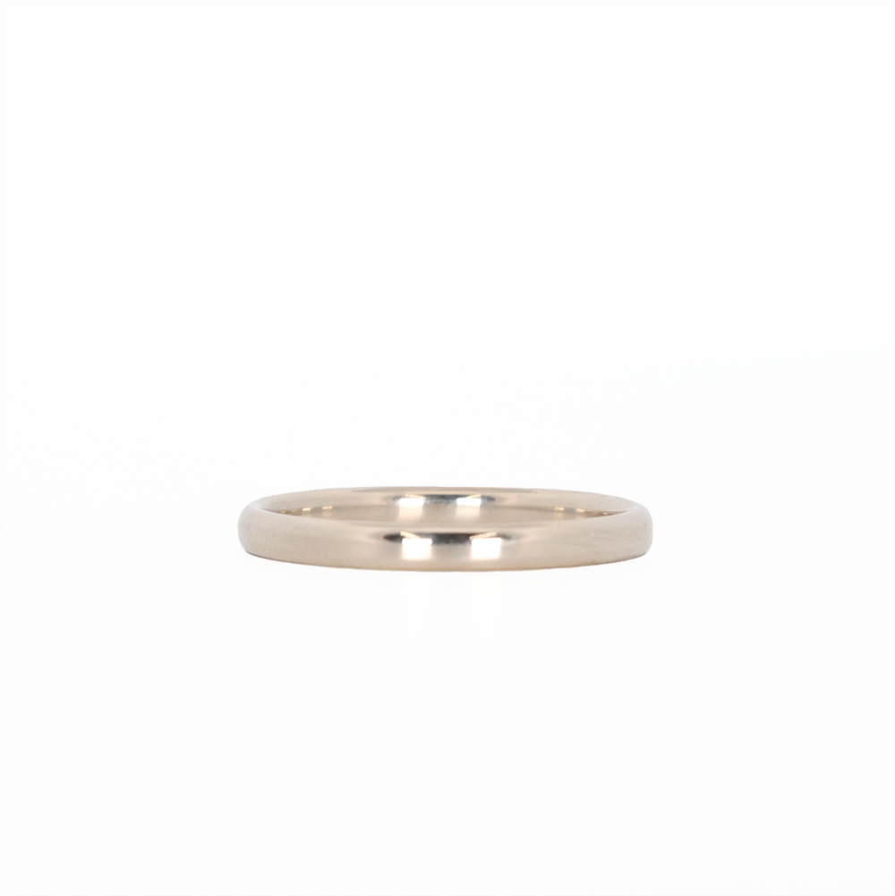 white gold stackable ring laying flat