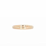 yellow gold stackable ring laying flat