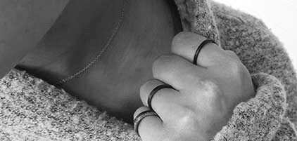 Carbon Fiber Stackable Ring worn on a women's finger