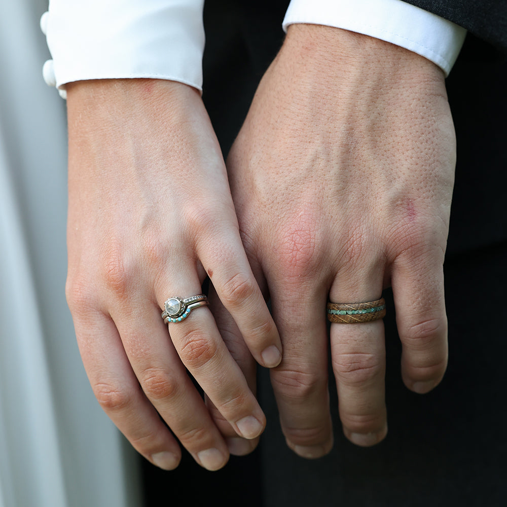 Turquoise Inlay Ring with Whiskey Barrel Wood and Carbon Fiber Sleeve Wedding Ring Worn At A Wedding